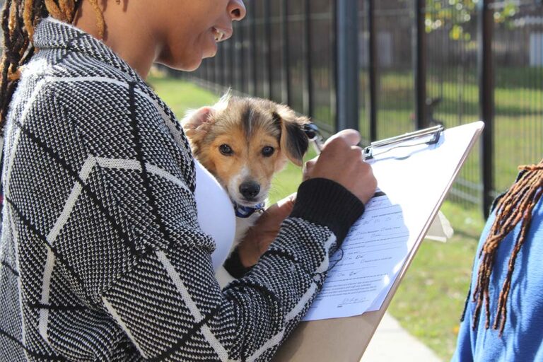 pets.findhelp.com - HASS Data and Research - woman filling out a form at Humane Rescue Alliance